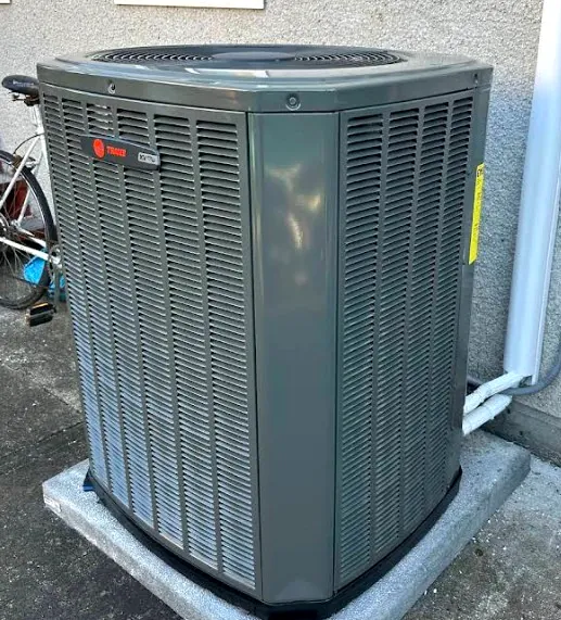 Trane XR series unit installed on a concrete pad