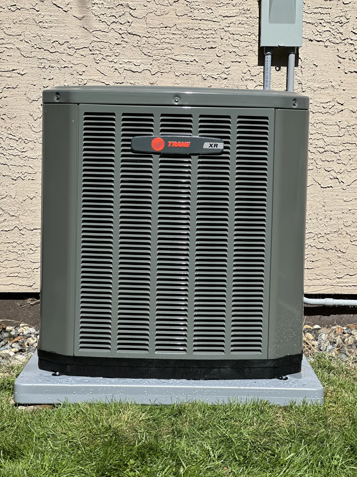 Trane heat pump installed on a level pad, tested and running