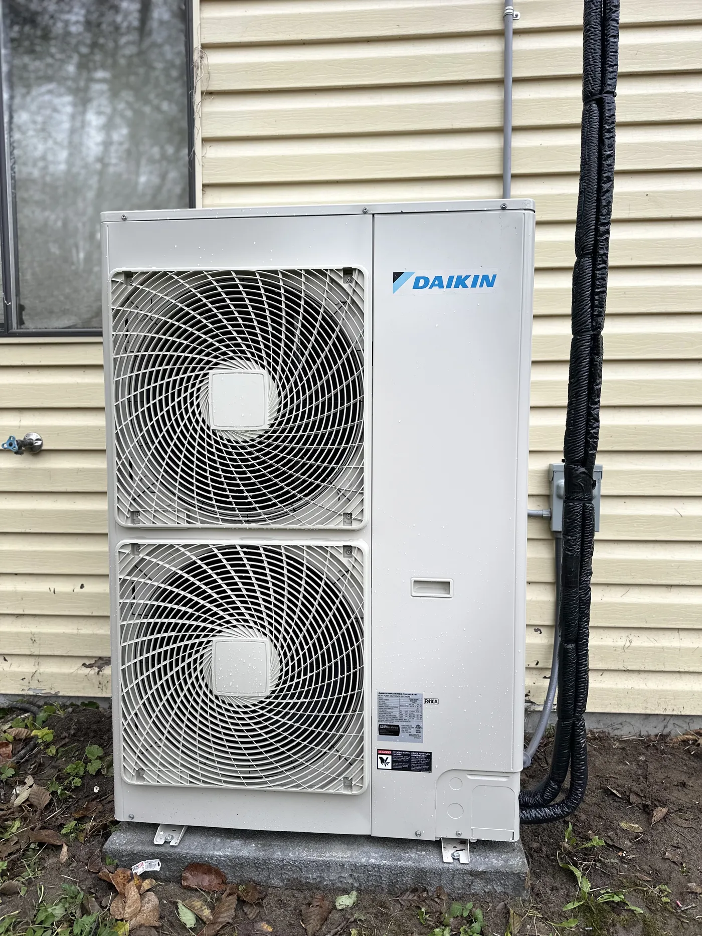 Daikin twin-fan heat pump, wired, levelled, and commissioned