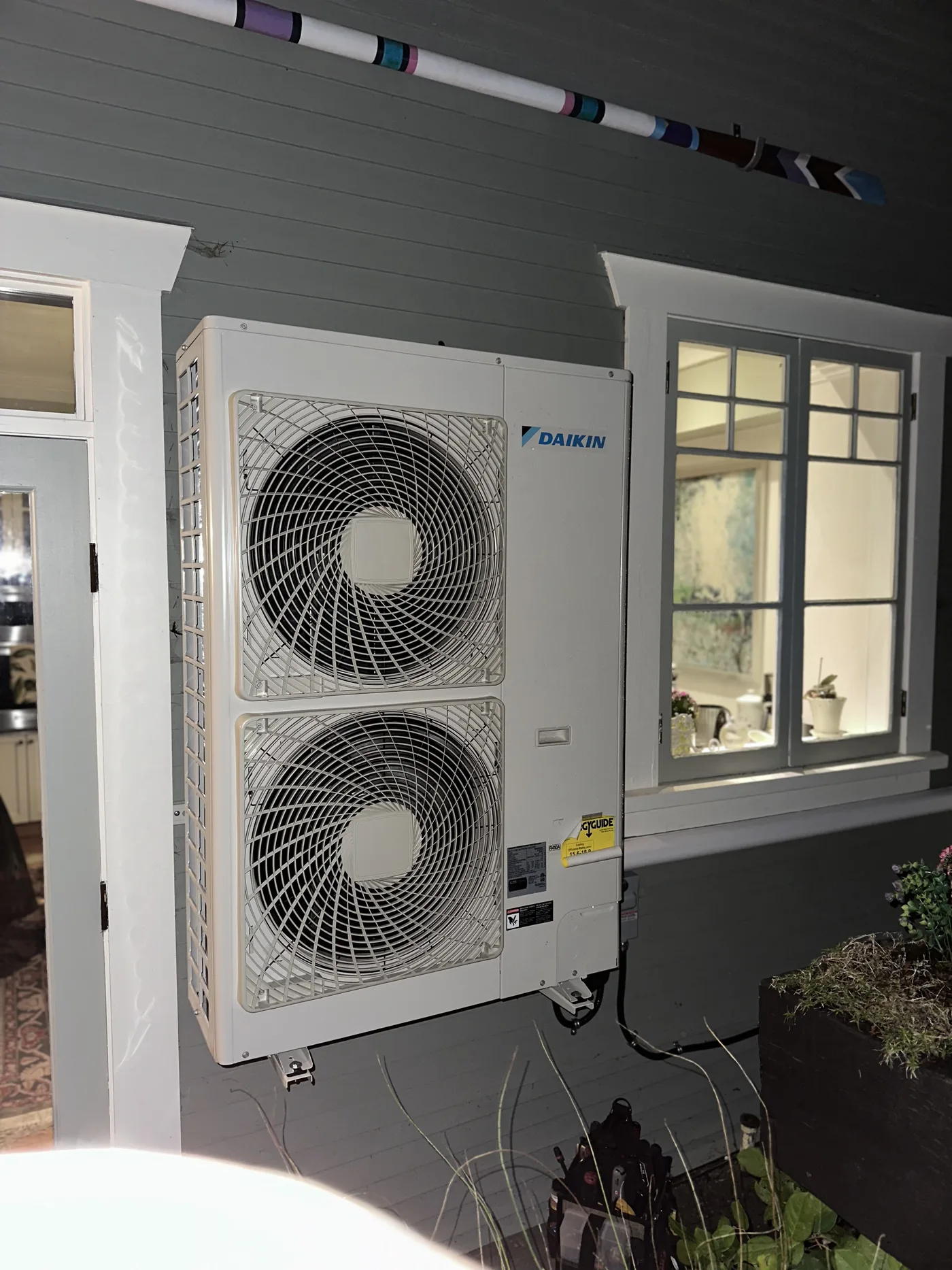 Daikin heat pump mounted clear of the wall
