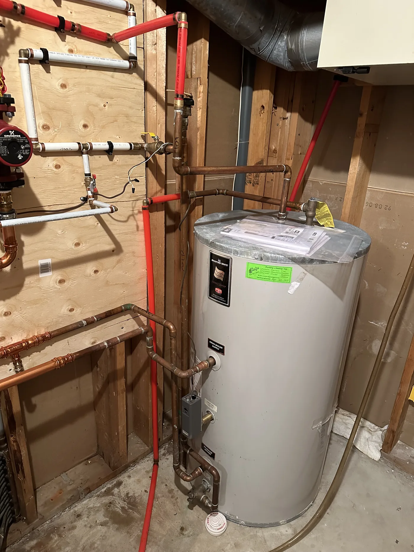 New hot water tank plumbed in clean copper